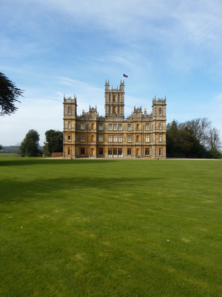 'Downton Abbey' [Highclere Castle]  with its lawn that stretches to the walls of the house.